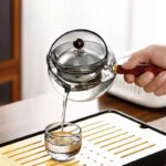 Semi-automatic Rotary Heat-resistant Glass Teapot With Infuser And Wooden Handle