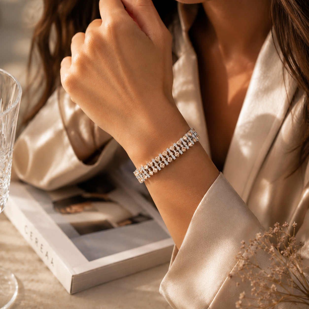 Woman wearing a luxury AAA zircon crystal bracelet with champagne stones in an elegant lifestyle setting.