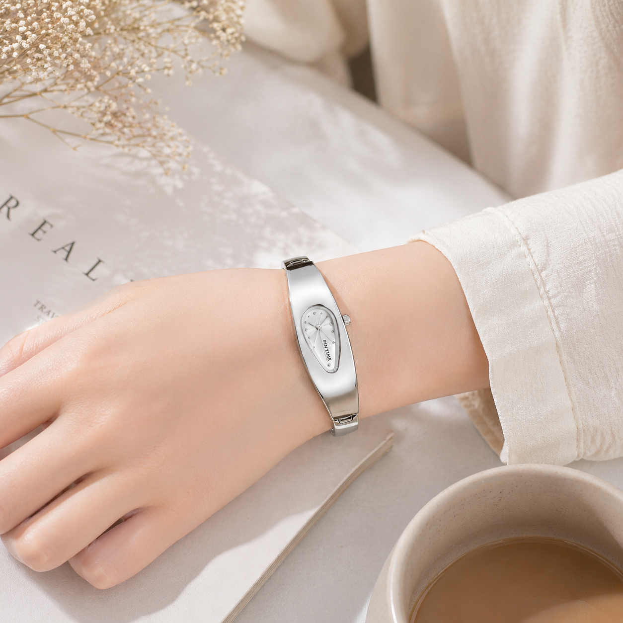minimalist jewelry watch for women in silver white worn on wrist