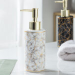 White and black marble soap dispenser with gold pump