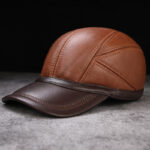 Men’s Leather Cap – Stylish Brown Baseball Cap Left side profile of men’s light brown leather baseball cap