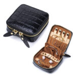 Genuine leather travel jewelry case with crocodile embossed black finish and organized compartments