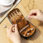 Genuine leather travel jewelry case with crocodile embossed finish and organized compartments